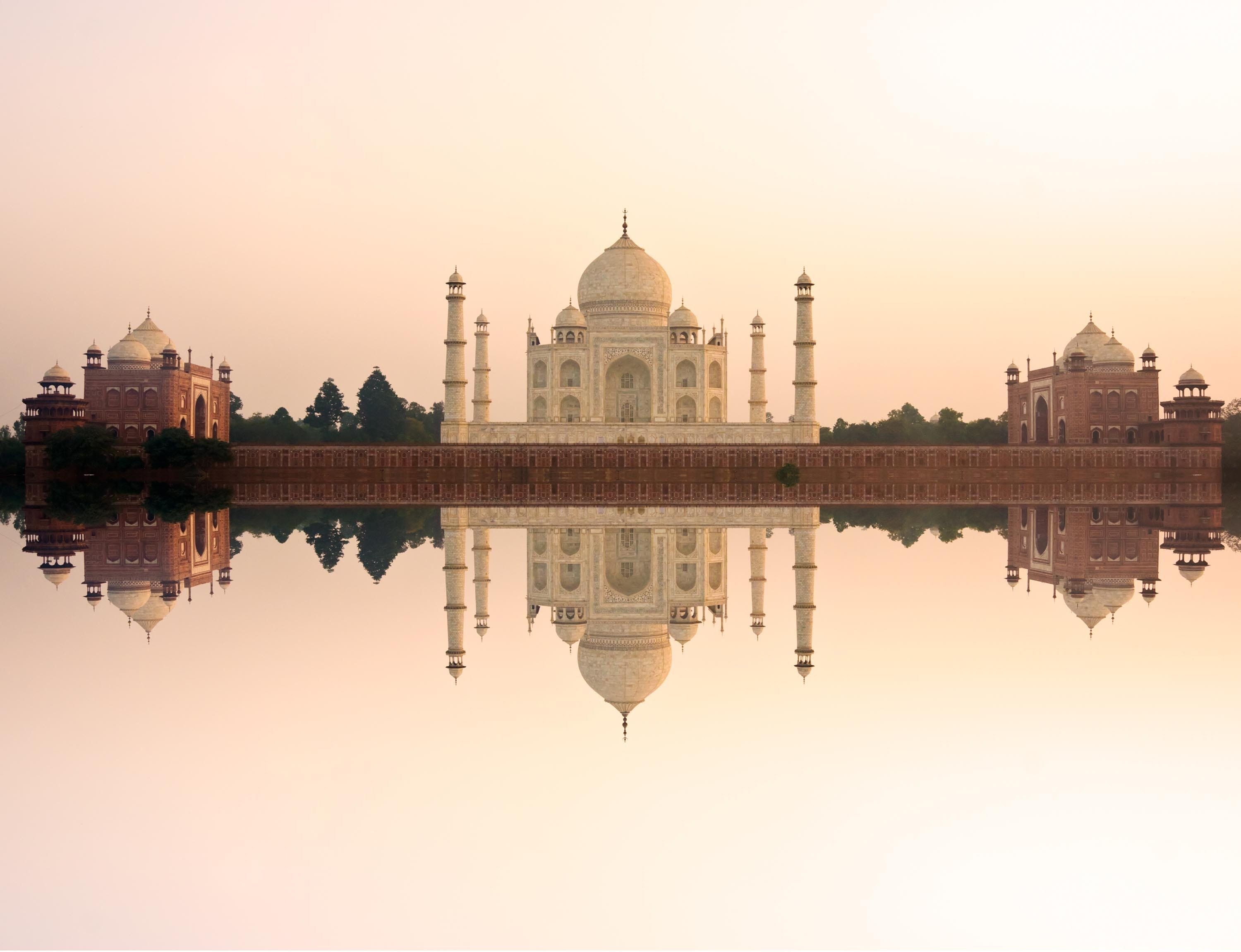 Panoramic view of Taj Mahal at sunset with reflection, Agra, India. 